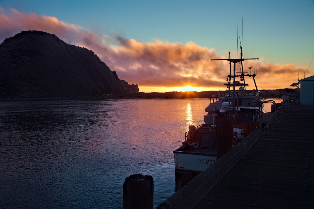 Sitting on a Dock at Sunset, Watching the Last Glimmer of Sunlight Fade Over the Calm Water