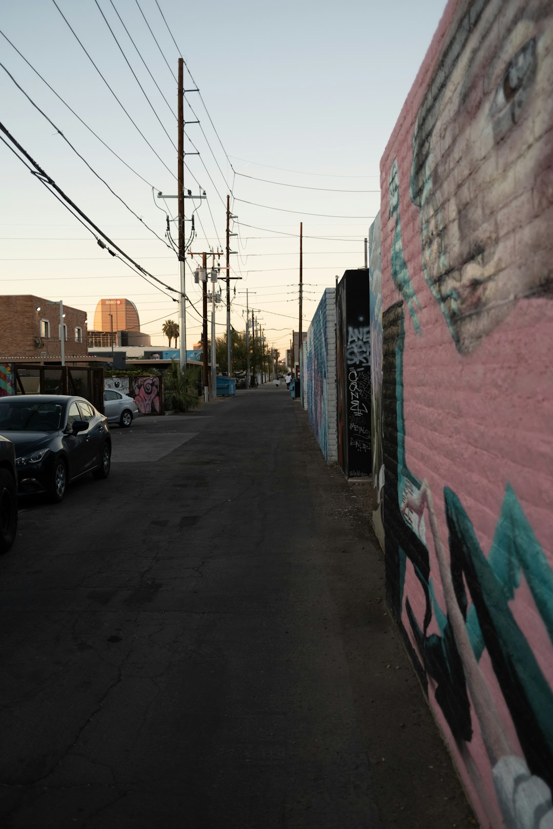 Walking Down a Quiet Alley at Sunset, The Golden Light Cast Across the Pavement