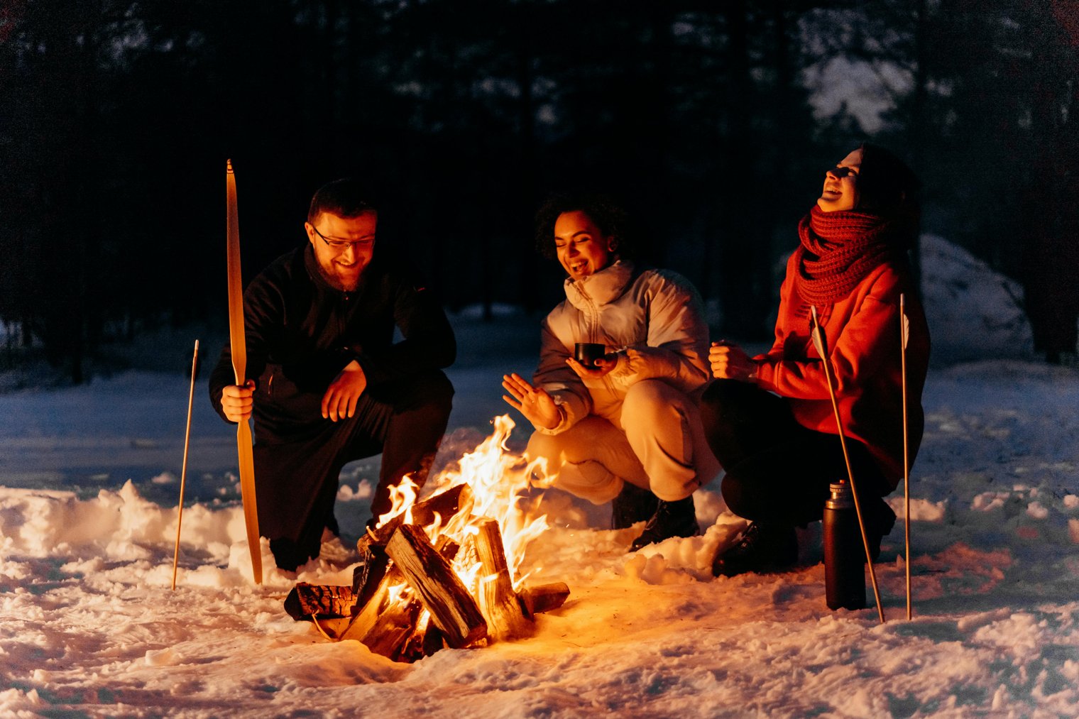 Sitting by a Bonfire with Friends, Watching the Flames Dance Under a Starry Sky